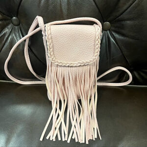 Crossbody pink faux leather bag with fringes